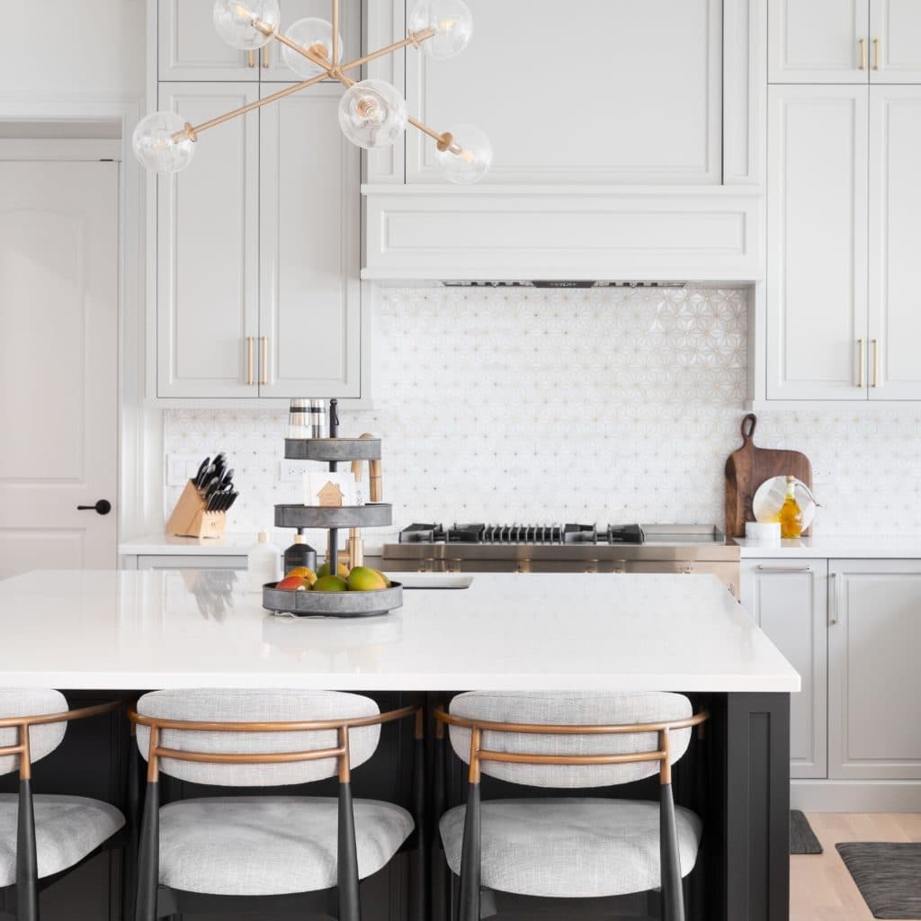 Beautiful white kitchen with gold fixtures in an Airdrie home