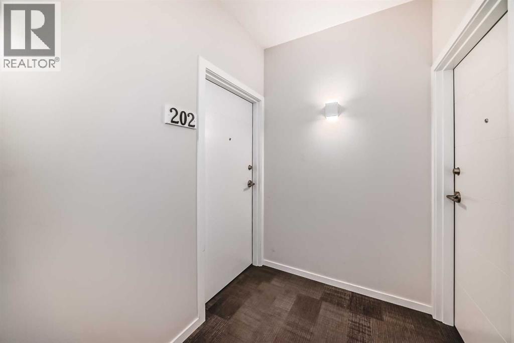 202, 245 Redstone Walk NE — photo 3