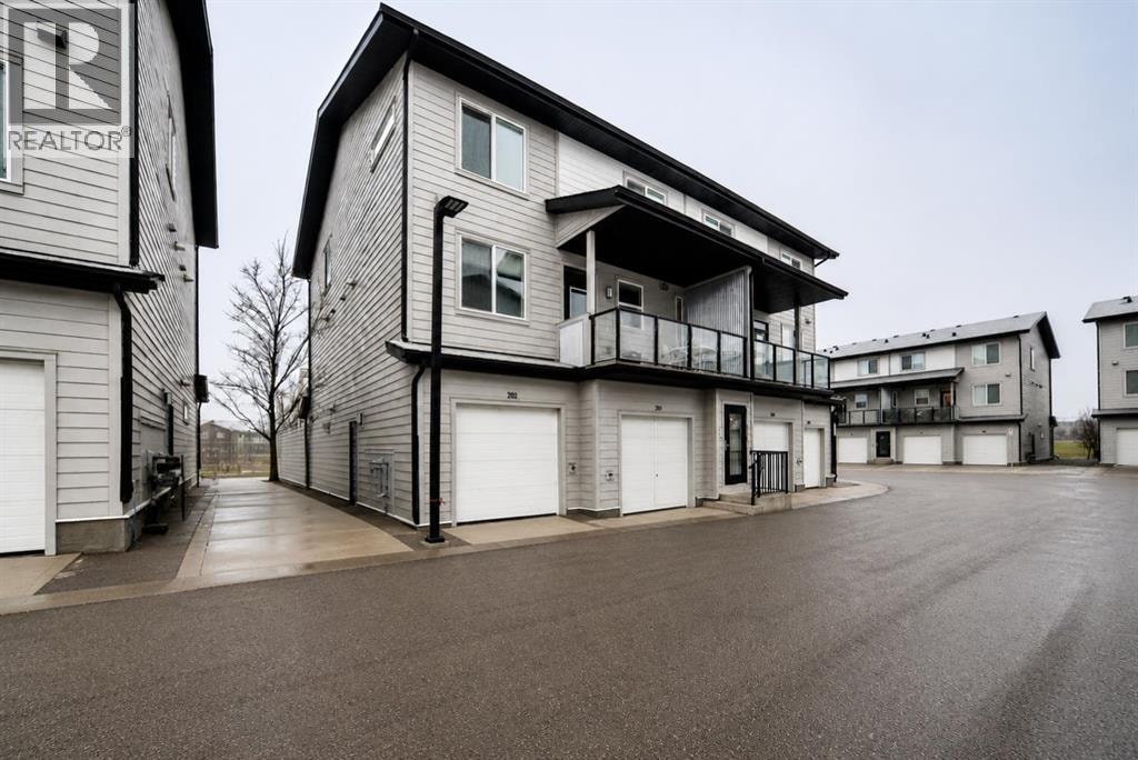 202, 245 Redstone Walk NE — photo 1