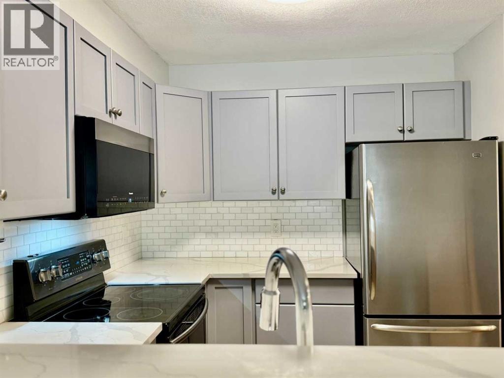1212, 2518 Fish Creek Boulevard SW — photo 3