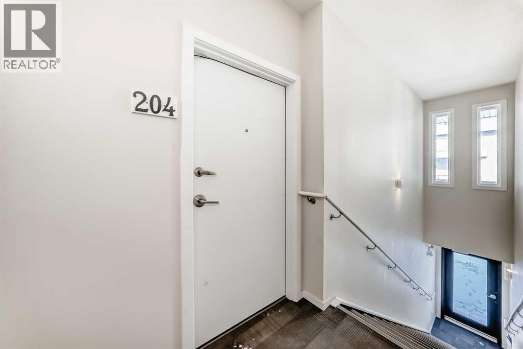 204, 135 Redstone Walk NE — photo 32