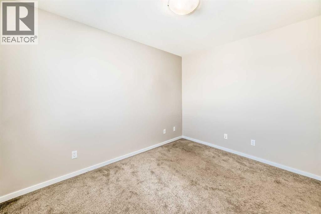 204, 135 Redstone Walk NE — photo 25