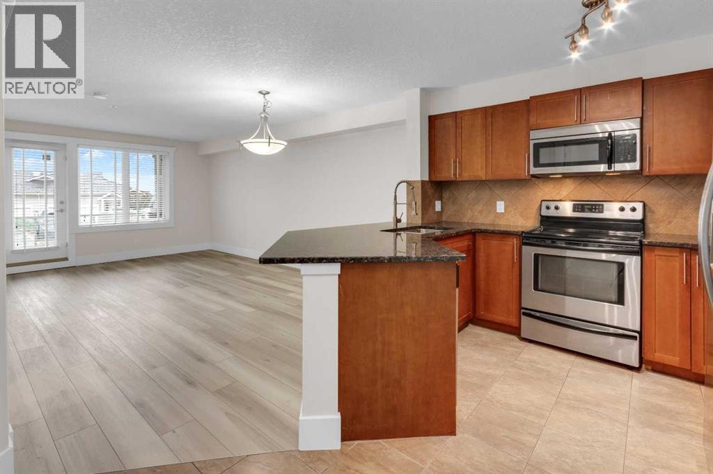 102, 500 Rocky Vista Gardens NW — photo 3