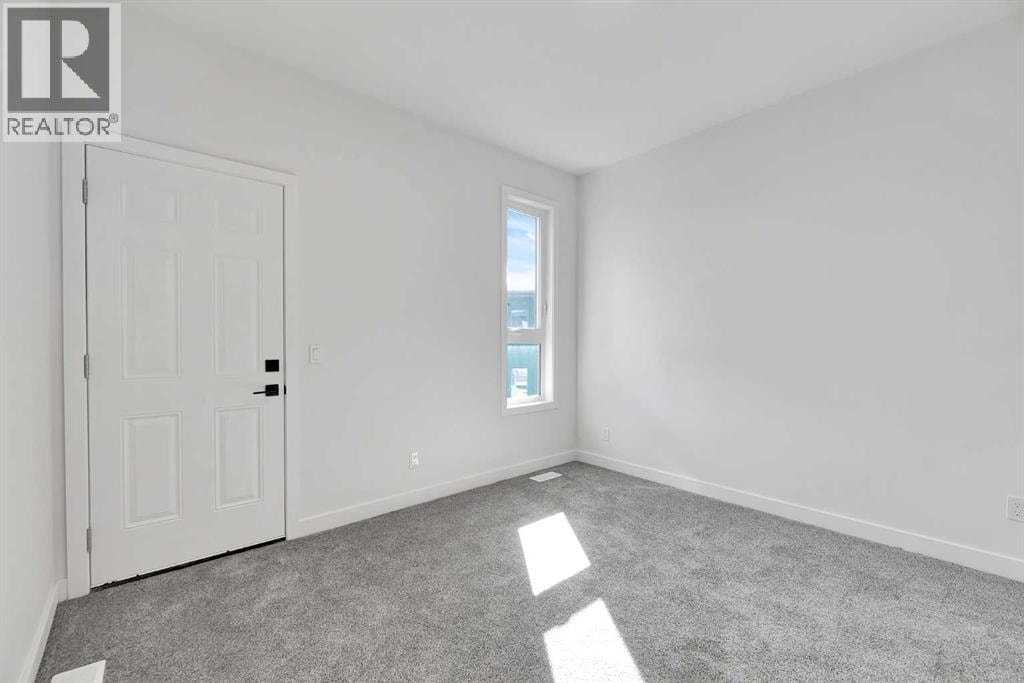 4905 Bowness Road NW — photo 13