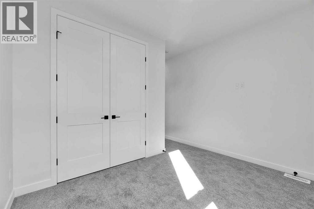 4905 Bowness Road NW — photo 14