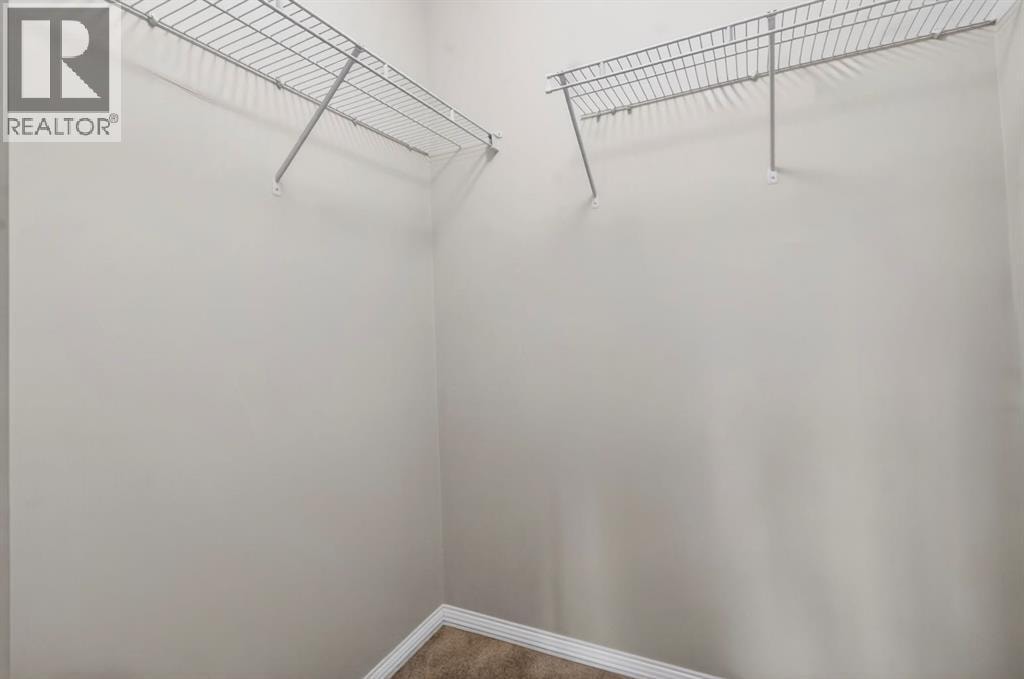 7103, 304 Mackenzie Way SW — photo 20