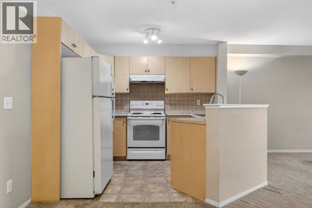 7103, 304 Mackenzie Way SW — photo 11