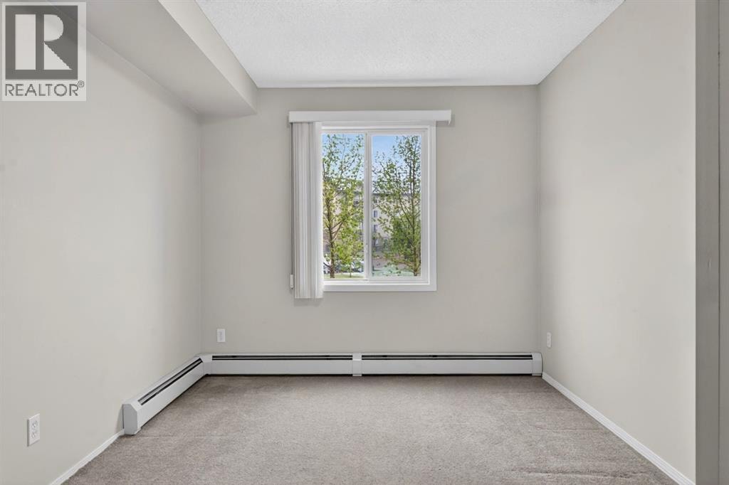 7103, 304 Mackenzie Way SW — photo 21