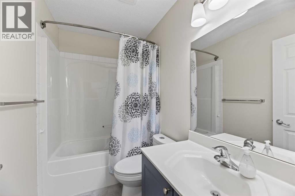 8474 Saddleridge Drive NE — photo 20
