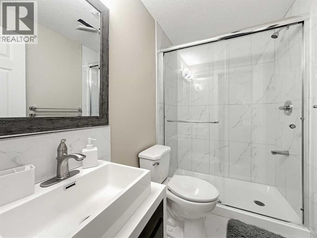 8474 Saddleridge Drive NE — photo 28