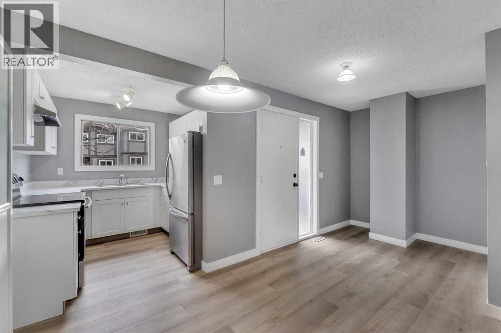 104, 7172 Coach Hill Road SW — photo 5