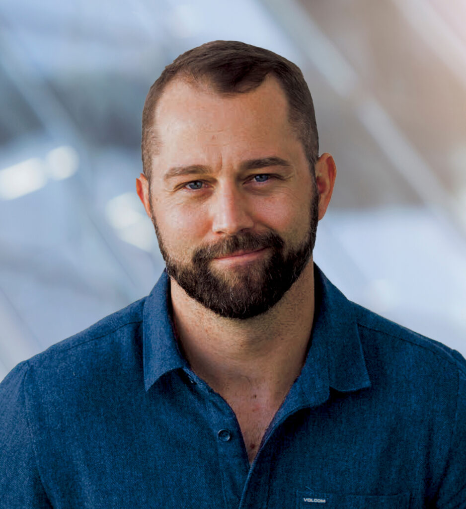 joyful businessman smiling standing in urban area in city
